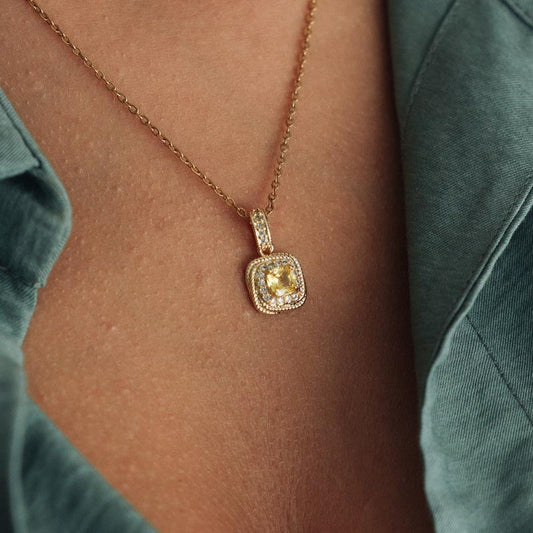 Gold Colored Necklace and Earrings Set with Spiral Texture and Yellow Stone